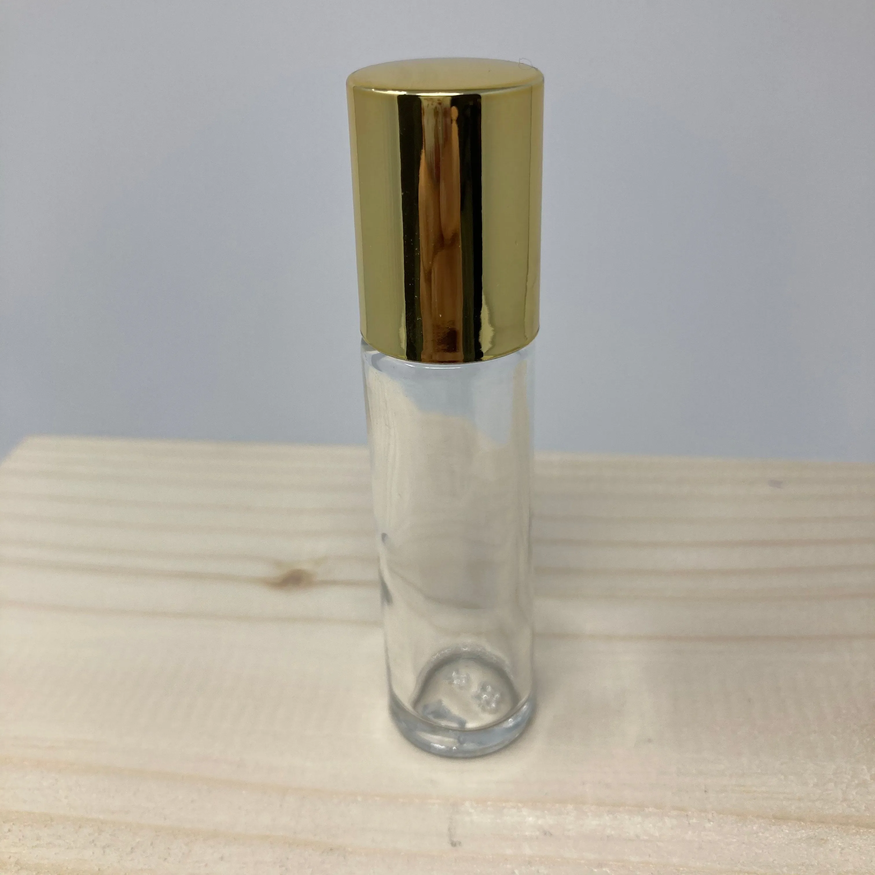 Clear Glass Bottle With Roll-On Applicator And Lid